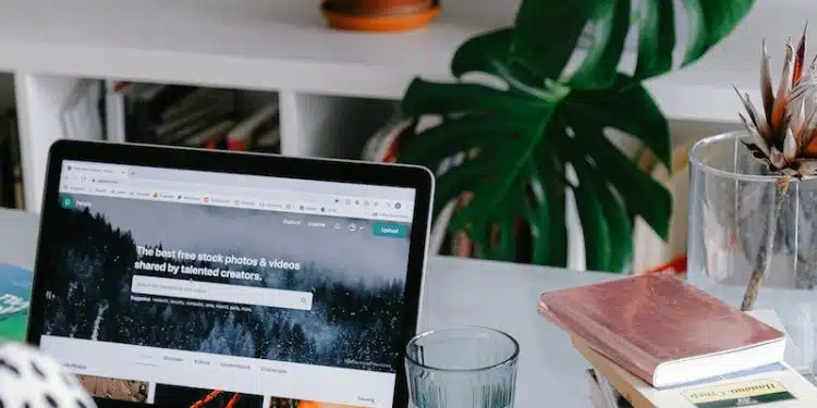 Person Using Macbook Pro on Table